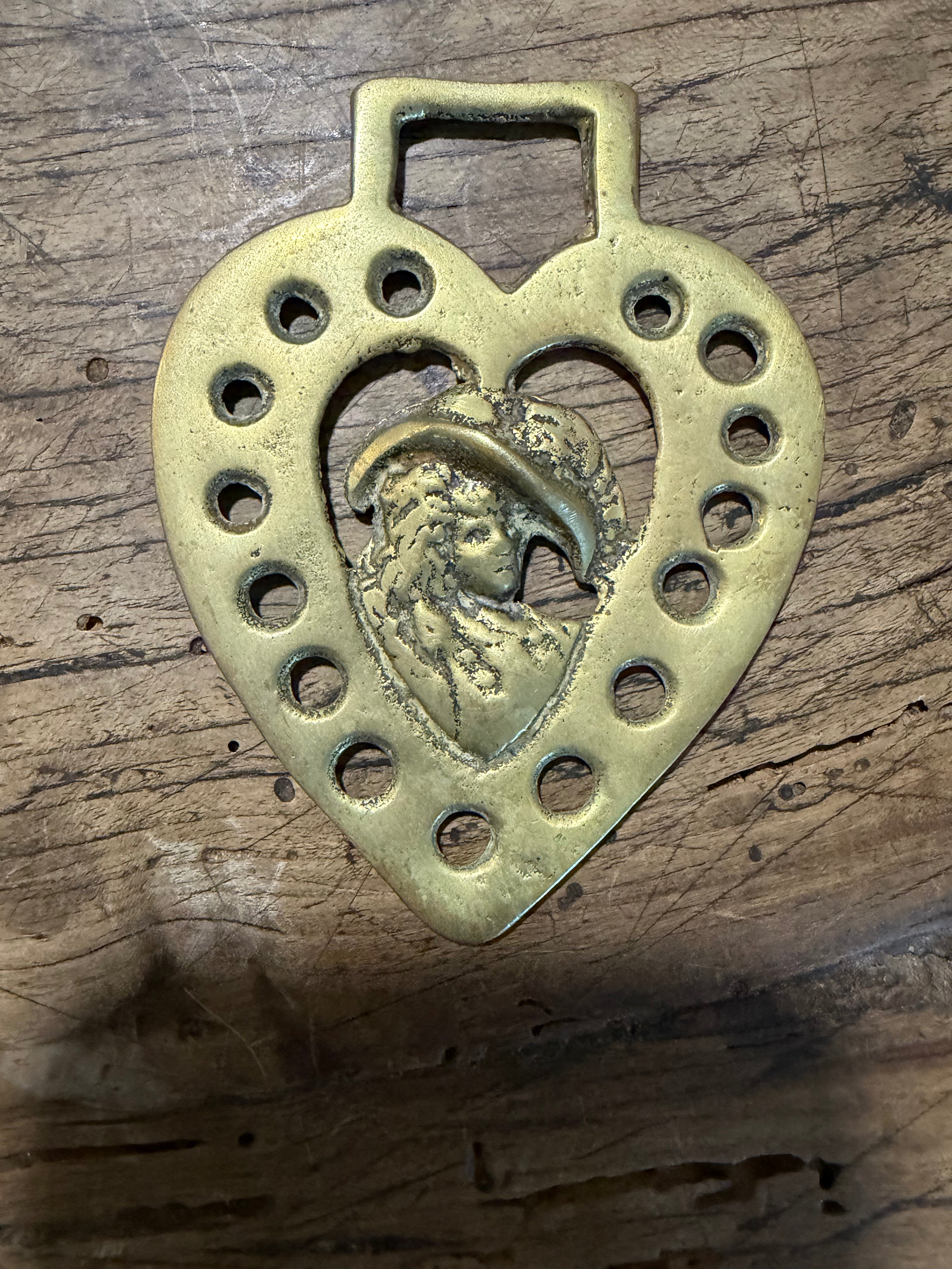 Heart-Shaped Horse Brass with Woman in a Hat